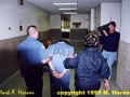 Suspect Linda Henning in handcuffs