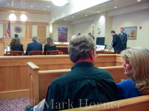 Two unidentified friends of Linda Henning are seated in the courtroom to offer her their support.